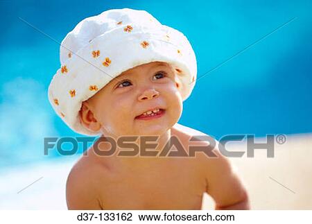 Stock Image - Baby on the beach. Fotosearch