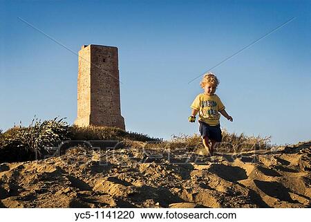 Baby playing on the dune View Large Photo Image Stock Image - Baby playing on the dune. Fotosearch