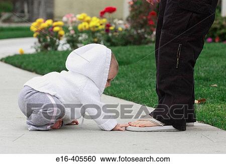 baby playing with mother's feet View Large Photo Image Stock Image - baby playing with mother's feet. Fotosearch
