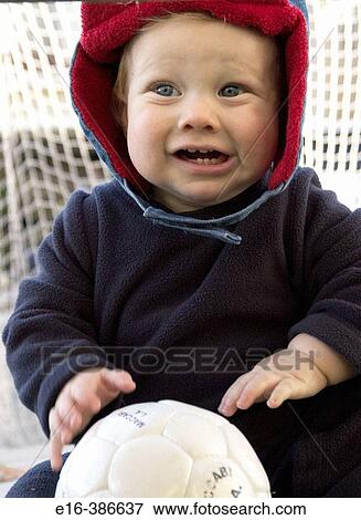 Stock Photo - baby playing with soccer ball. Fotosearch