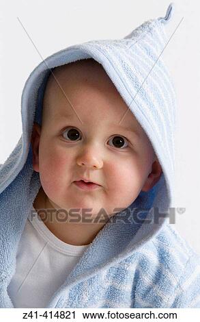 Stock Image - Baby portrait in bathing wrap. Fotosearch