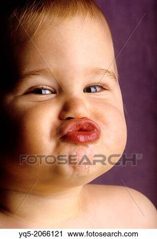 baby puckers lips with drool on chin. View Large Photo Image Stock Image - baby puckers lips with drool on chin.. Fotosearch