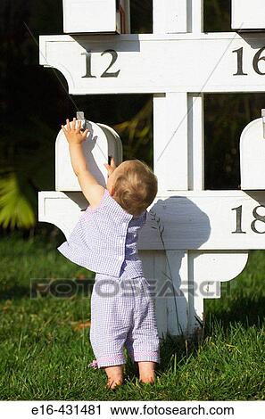 Baby reaching for mailbox. View Large Photo Image Stock Image - Baby reaching for mailbox.. Fotosearch