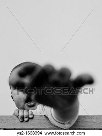 Baby reaching out View Large Photo Image Picture - Baby reaching out. Fotosearch