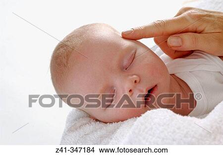 Baby resting on mum's arms View Large Photo Image Picture - Baby resting on mum's arms. Fotosearch
