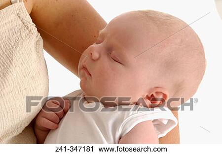 Baby resting on mum's arms View Large Photo Image Stock Image - Baby resting on mum's arms. Fotosearch