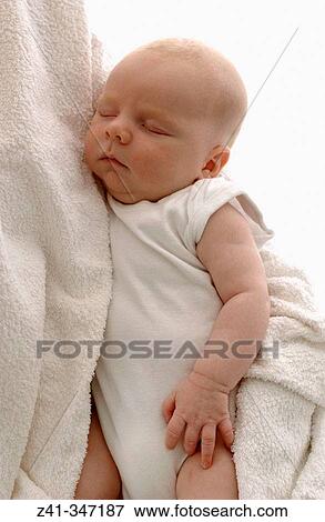 Baby resting on mum's arms View Large Photo Image Stock Photo - Baby resting on mum's arms. Fotosearch