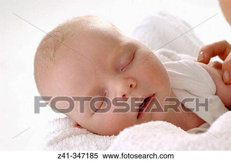 Baby resting on mum's arms View Large Photo Image Stock Photography - Baby resting on mum's arms. Fotosearch