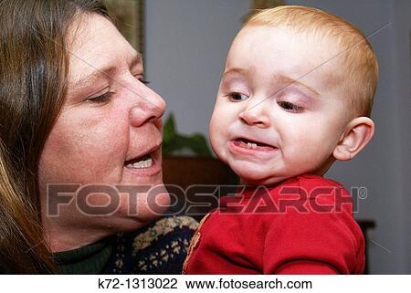 Baby shows off two new front teeth View Large Photo Image Stock Image - Baby shows off two new front teeth. Fotosearch
