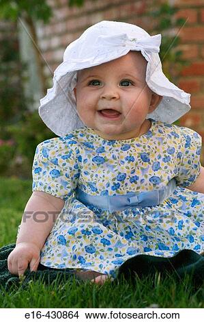 Baby sitting on grass. View Large Photo Image Picture - Baby sitting on grass.. Fotosearch