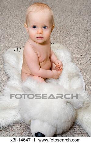 Baby sitting on white bear rug St Paul Minnesota MN USA View Large Photo Image Stock Image - Baby sitting on white bear rug St Paul Minnesota MN USA. Fotosearch
