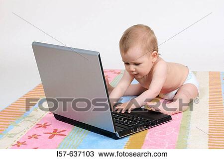 Baby sitting, wearing nappies, playing with laptop computer, Studio, Oetwil am See, Zuerich, Switzerland View Large Photo Image Stock Image - Baby sitting, wearing nappies, playing with laptop computer, Studio, Oetwil am See, Zuerich, Switzerland. Fotosearch