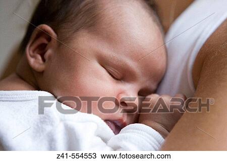 Baby sleeping on mothers arm. View Large Photo Image Stock Image - Baby sleeping on mothers arm.. Fotosearch