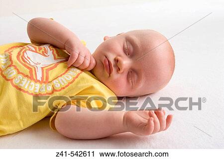 Baby sleeping on the floor. View Large Photo Image Stock Image - Baby sleeping on the floor.. Fotosearch