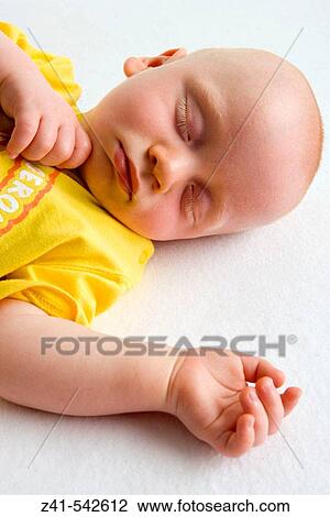 Baby sleeping on the floor. View Large Photo Image Stock Image - Baby sleeping on the floor.. Fotosearch