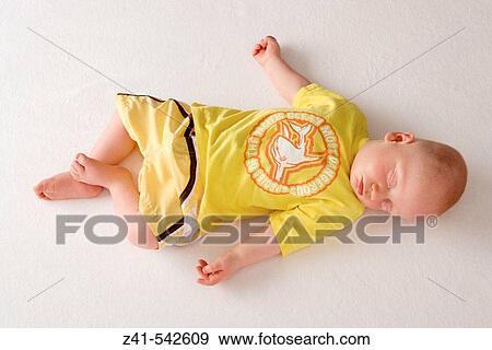 Baby sleeping on the floor. View Large Photo Image Stock Photo - Baby sleeping on the floor.. Fotosearch