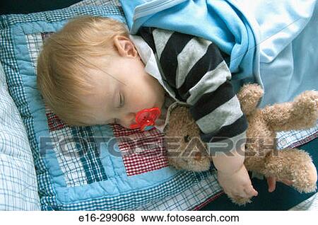 baby sleeping with teddy bear View Large Photo Image Stock Photo - baby sleeping with teddy bear. Fotosearch