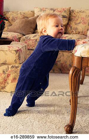 Baby starting to stand View Large Photo Image Stock Photo - Baby starting to stand. Fotosearch