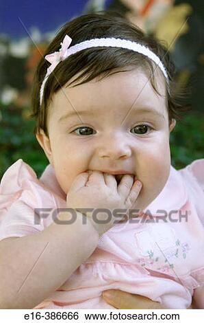 Stock Photograph - baby sucking fingers. Fotosearch