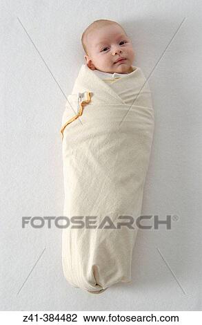 Baby swaddled View Large Photo Image Stock Image - Baby swaddled. Fotosearch
