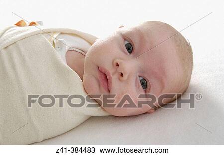 Stock Image - Baby swaddled. Fotosearch