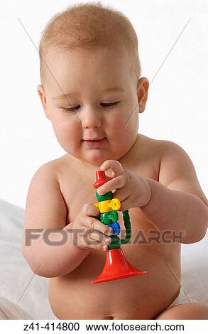 Baby with a toy View Large Photo Image Stock Image - Baby with a toy. Fotosearch
