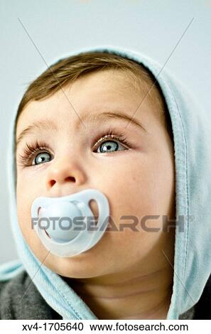 Baby with dummy posed at bedroom View Large Photo Image Stock Image - Baby with dummy posed at bedroom. Fotosearch