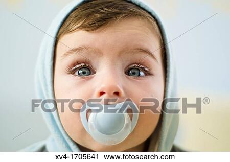 Baby with dummy posed at bedroom View Large Photo Image Stock Image - Baby with dummy posed at bedroom. Fotosearch