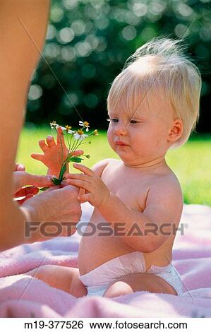 baby with flowers View Large Photo Image Stock Photograph - baby with flowers. Fotosearch