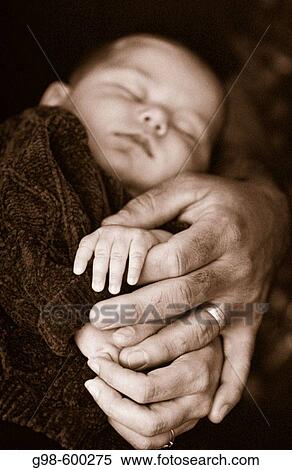 Baby with hands of parents in black and white View Large Photo Image Stock Photography - Baby with hands of parents in black and white. Fotosearch