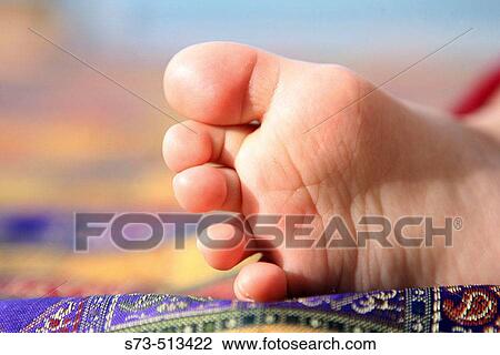 Stock Image - Baby's foot. Fotosearch