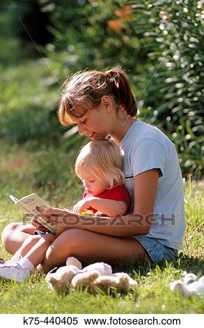 babysitter reading to toddler View Large Photo Image Stock Photography - babysitter reading to toddler. Fotosearch