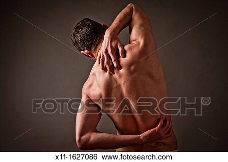 Back ache pain hurt man male person rubbing back View Large Photo Image Stock Photograph - Back ache pain hurt man male person rubbing back. Fotosearch