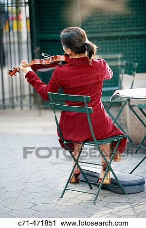 Back of a woman playing the violin View Large Photo Image Stock Image - Back of a woman playing the violin. Fotosearch