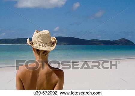 Back of a woman wearing a cowboy hat, Whitehaven Beach, Australia. View Large Photo Image Stock Image - Back of a woman wearing a cowboy hat, Whitehaven Beach, Australia.. Fotosearch
