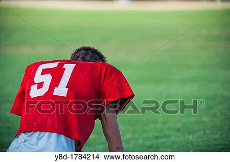 Back side of exhausted American football player without helmet View Large Photo Image Picture - Back side of exhausted American football player without helmet. Fotosearch