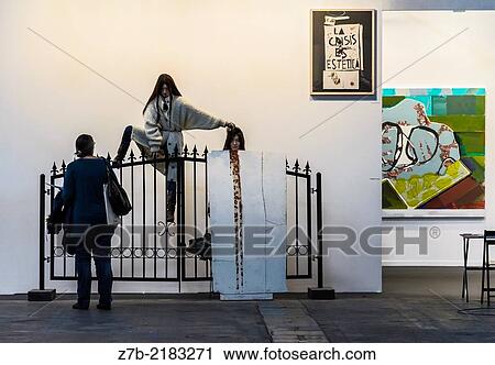 Back view of a woman looking a sculpture in a gallery fine art, Madrid city, Spain. View Large Photo Image Stock Image - Back view of a woman looking a sculpture in a gallery fine art, Madrid city, Spain.. Fotosearch