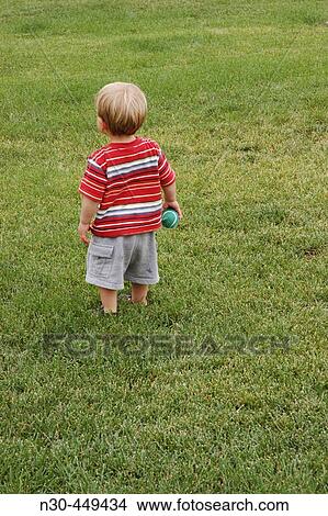 Back view of little boy with ball View Large Photo Image Picture - Back view of little boy with ball. Fotosearch
