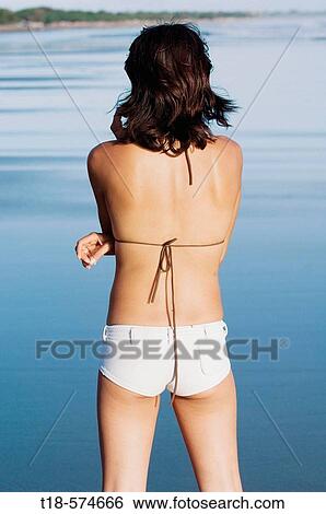 back view of woman posing on beach View Large Photo Image Stock Photograph - back view of woman posing on beach. Fotosearch