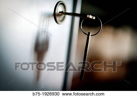 Backlight of a key in the lock of a door, Spotlight View Large Photo Image Stock Image - Backlight of a key in the lock of a door, Spotlight. Fotosearch