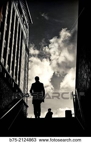 backlight silhouetting an unrecognizable man climbing the stairs of a station of the London Underground in London Bridge, London, England, UK View Large Photo Image Stock Image - backlight silhouetting an unrecognizable man climbing the stairs of a station of the London Underground in London Bridge, London, England, UK. Fotosearch
