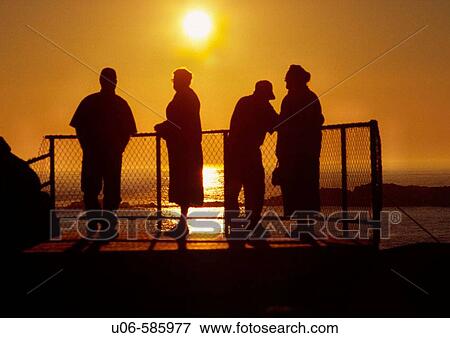backlit group of old people watching a sunset from a lookoff View Large Photo Image Stock Photo - backlit group of old people watching a sunset from a lookoff. Fotosearch
