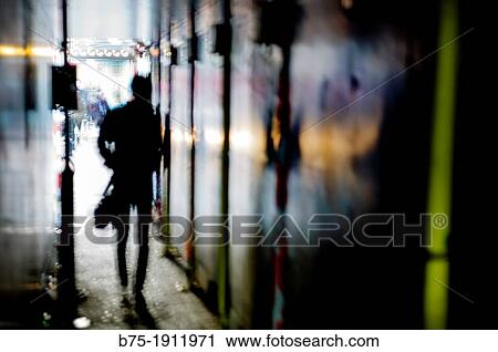 backlit person walking down an alley in East London, London, England, UK View Large Photo Image Stock Image - backlit person walking down an alley in East London, London, England, UK. Fotosearch