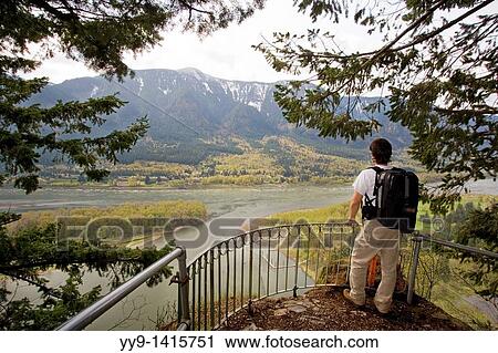 Backpacker at overlook on Beacon Rock - Beacon Rock State Park, North Bonneville, Washington View Large Photo Image Stock Image - Backpacker at overlook on Beacon Rock - Beacon Rock State Park, North Bonneville, Washington. Fotosearch