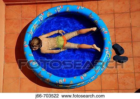 Stock Image - Backyard swimming poo. Fotosearch