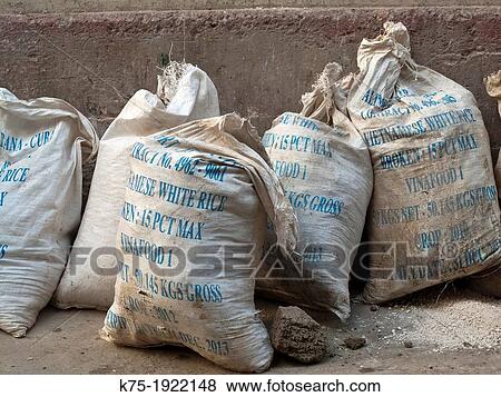 Bags of imported rice on streets of Havana, Cuba View Large Photo Image Stock Photo - Bags of imported rice on streets of Havana, Cuba. Fotosearch
