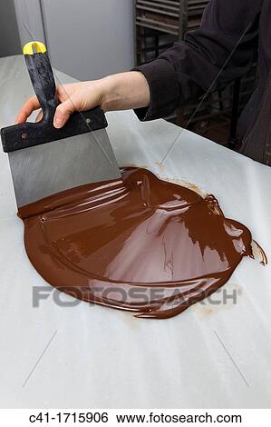 Baker making chocolate View Large Photo Image Stock Photograph - Baker making chocolate. Fotosearch