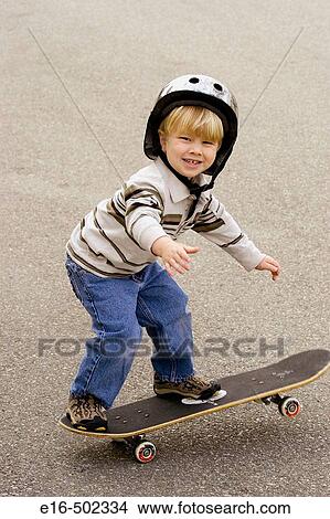 Balancing boy on skateboard View Large Photo Image Picture - Balancing boy on skateboard. Fotosearch