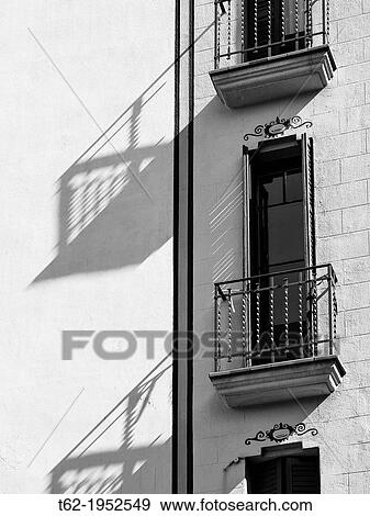 Balconies and shadows of a manor house in the Gracia district of Barcelona. View Large Photo Image Stock Photo - Balconies and shadows of a manor house in the Gracia district of Barcelona.. Fotosearch