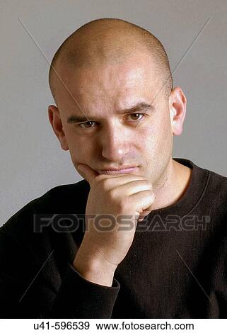 Bald 38 year old man showing a serious expression. View Large Photo Image Stock Photo - Bald 38 year old man showing a serious expression.. Fotosearch